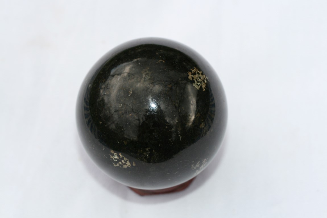 Nuummite Sphere activates the root Chakra 5225